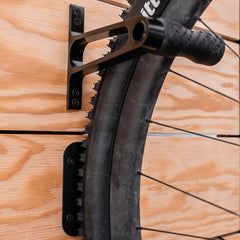 Lezyne bike display mount with CNC alloy wheel hook for bicycle storage and organization.
