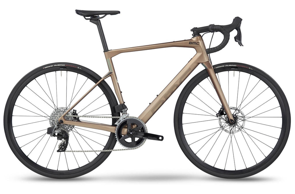 BMC Road Machine FOUR 2023 road bike with brown frame, drop handlebars, and sleek design for road cycling.