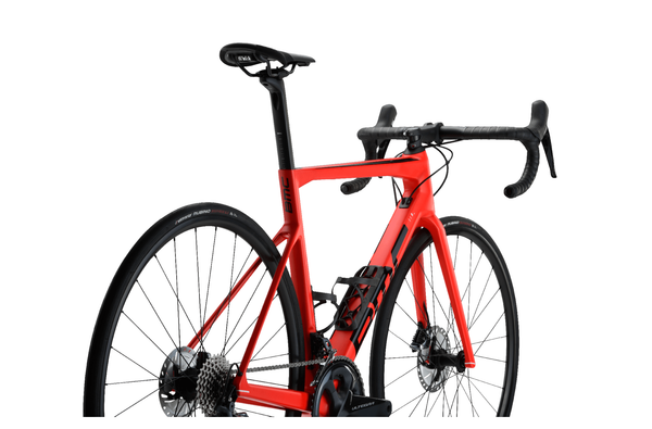Red and black BMC Teammachine SLR FIVE 2022 road bike with aerodynamic frame and drop handlebars, ready for competitive cycling.
