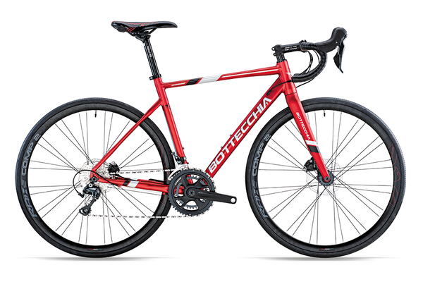 Red Bottecchia Duello Shimano 105 2022 road bike with lightweight frame and drop handlebars, ready for road cycling.